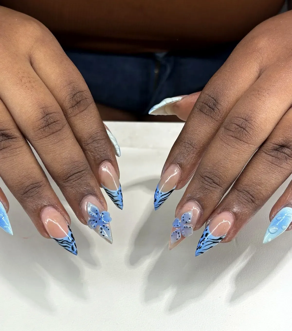 Gel-X stiletto nails with blue tiger French